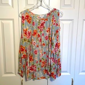 Floral blouse with peek-a-boo shoulders.